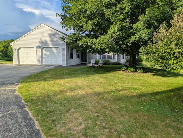 27 Orchard Ln, Minot, ME 04258 - view of front of home featuring driveway, an attached garage, and a front yard