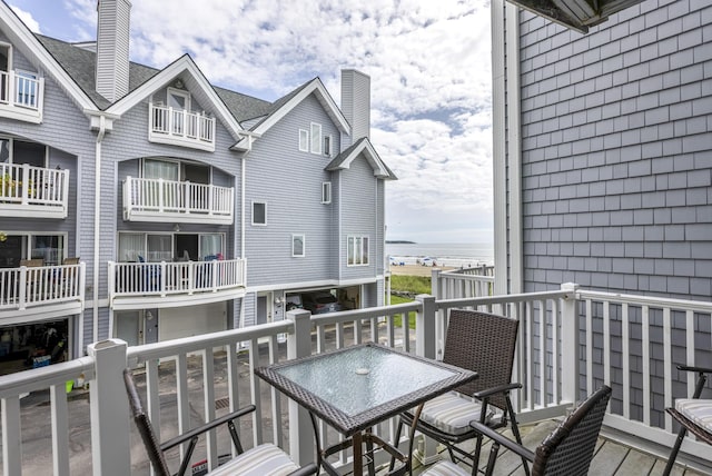 balcony featuring a water view