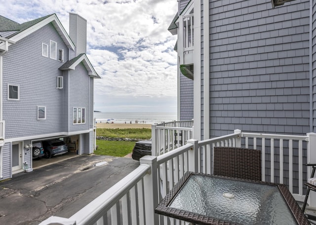balcony featuring a water view