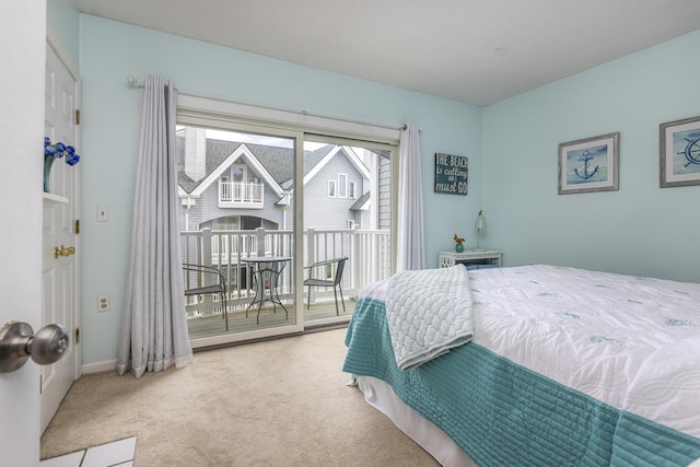 carpeted bedroom featuring access to outside