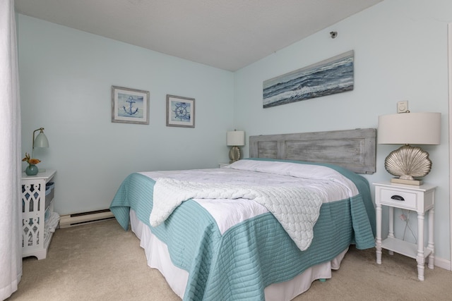 bedroom with a baseboard radiator and light colored carpet