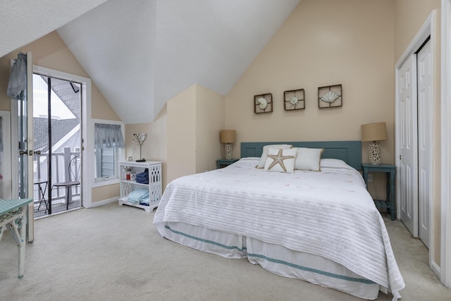 bedroom with light carpet, access to outside, a closet, and vaulted ceiling