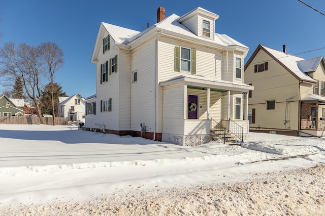 front of property featuring covered porch