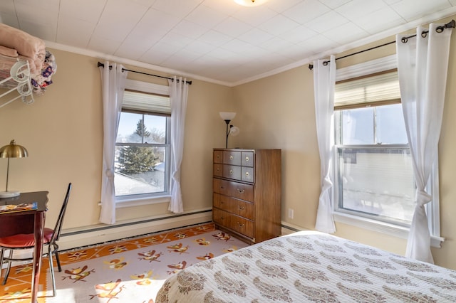 bedroom featuring crown molding and baseboard heating