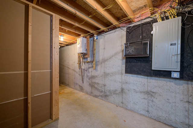 unfinished basement with water heater and electric panel