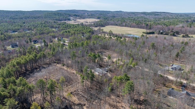 drone / aerial view with a view of trees