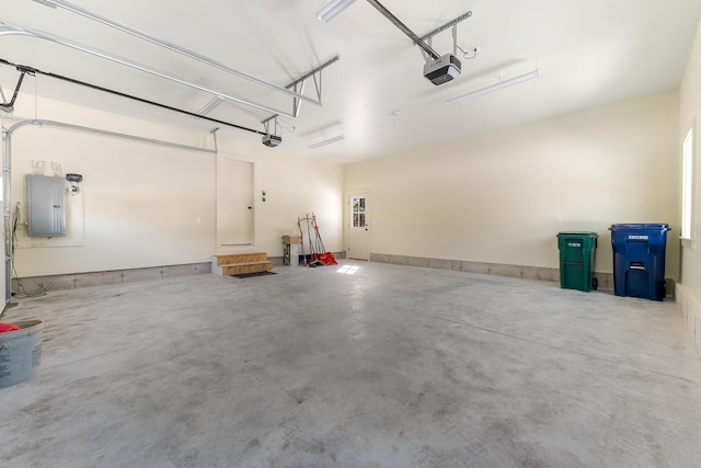 garage featuring electric panel and a garage door opener