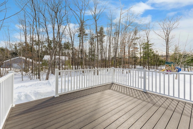 snow covered deck with a playground