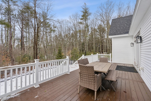 wooden terrace with outdoor dining space