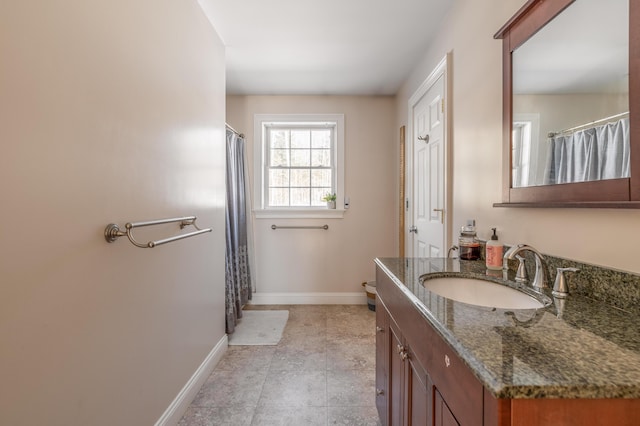 bathroom featuring tile patterned flooring and vanity