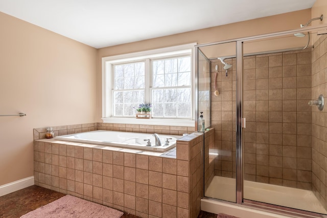 bathroom with separate shower and tub