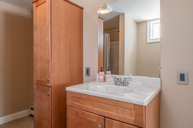 bathroom featuring vanity and a baseboard radiator