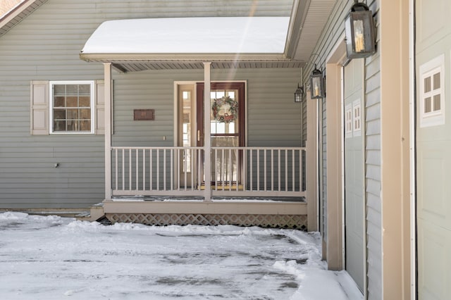 view of snow covered property entrance