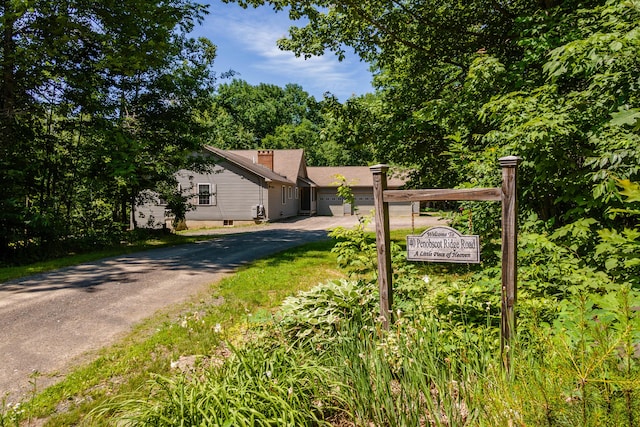 40 Penobscot Ridge Rd, Charleston, ME 04422 - view of front facade featuring asphalt driveway, a garage, and crawl space