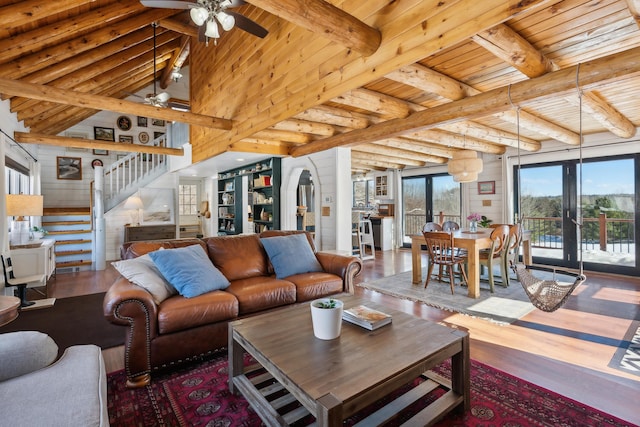 living room featuring hardwood / wood-style floors, wooden ceiling, french doors, and beamed ceiling