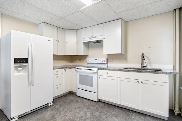 kitchen with under cabinet range hood, white cabinets, white appliances, and a sink