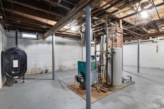 basement featuring heating fuel, water heater, and a heating unit