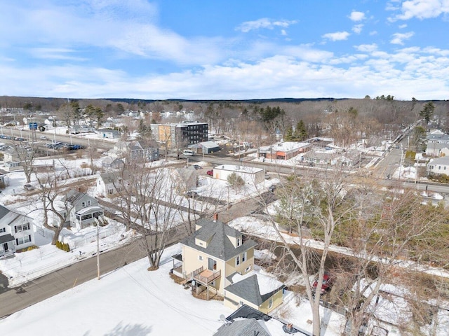 snowy aerial view featuring a residential view