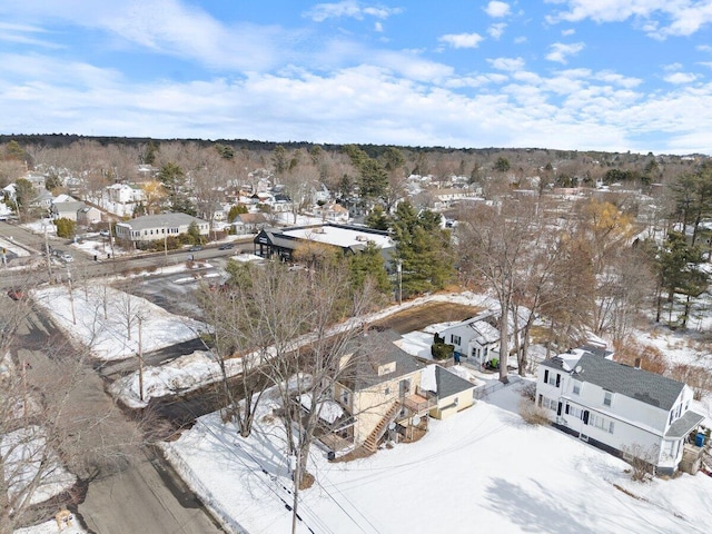 snowy aerial view featuring a residential view