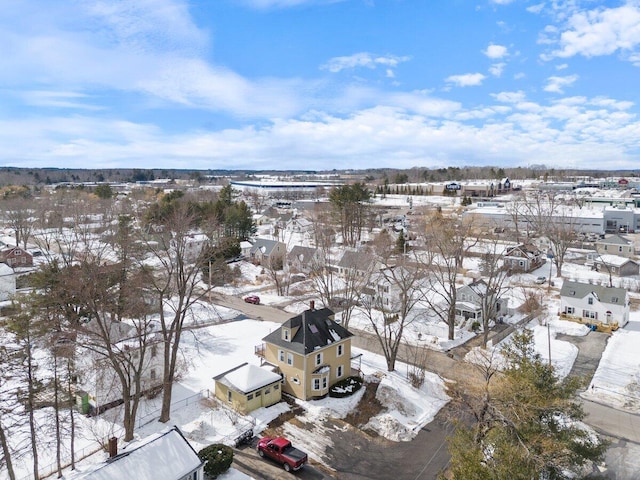 snowy aerial view with a residential view