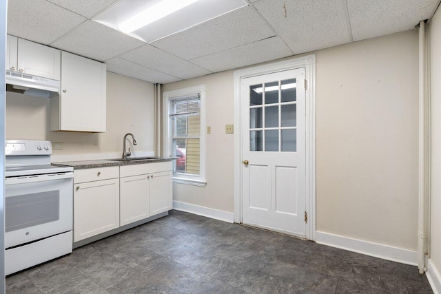 kitchen featuring electric range, white cabinets, under cabinet range hood, and a sink