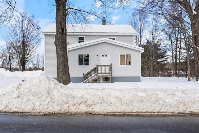 view of front of home with a chimney