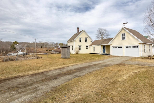 10 Leeman Hill Rd, Bristol, ME 04554 - view of front of house with dirt driveway, a chimney, a front yard, and roof with shingles