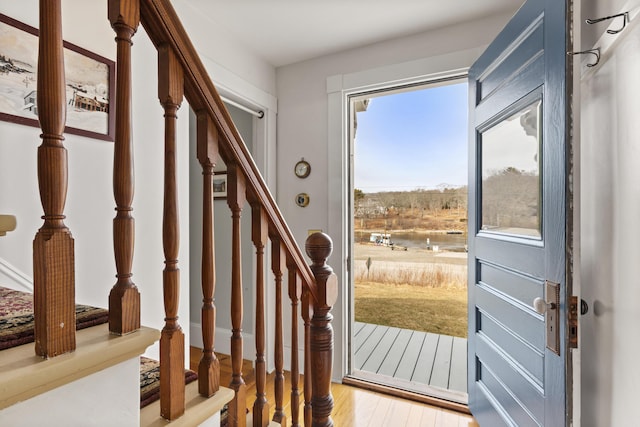 10 Leeman Hill Rd, Bristol, ME 04554 - doorway to outside with light wood-style floors, stairs, and a water view