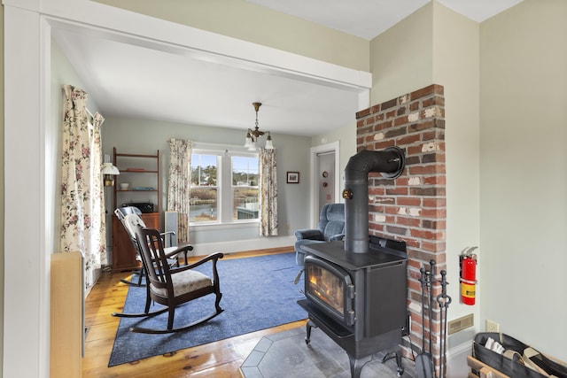 10 Leeman Hill Rd, Bristol, ME 04554 - living room with a wood stove and wood finished floors