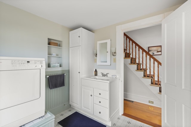 10 Leeman Hill Rd, Bristol, ME 04554 - laundry area featuring washer / dryer, built in shelves, and baseboards