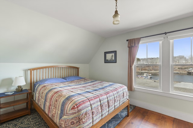 10 Leeman Hill Rd, Bristol, ME 04554 - bedroom featuring wood finished floors, baseboards, vaulted ceiling, and a water view