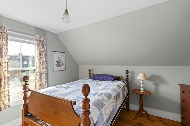 10 Leeman Hill Rd, Bristol, ME 04554 - bedroom featuring wood finished floors, vaulted ceiling, and baseboards