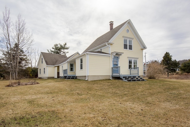 10 Leeman Hill Rd, Bristol, ME 04554 - rear view of property featuring a chimney, a wooden deck, a lawn, and a shingled roof
