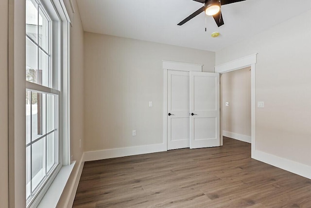 unfurnished bedroom featuring hardwood / wood-style flooring and ceiling fan