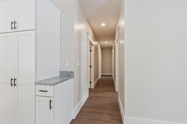 hall with dark hardwood / wood-style flooring