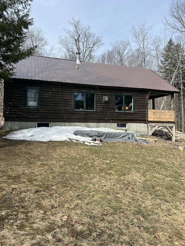 45 Dickson Rd, Carrying Place Town Twp, ME 04961 - back of house with metal roof and a yard