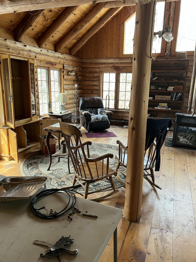 45 Dickson Rd, Carrying Place Town Twp, ME 04961 - sitting room with wood ceiling, lofted ceiling with beams, rustic walls, and light wood finished floors