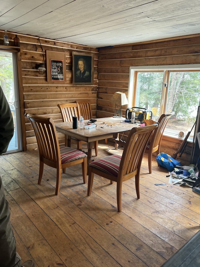 45 Dickson Rd, Carrying Place Town Twp, ME 04961 - dining area with wood ceiling, rustic walls, and wood-type flooring