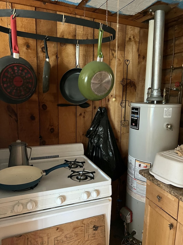 45 Dickson Rd, Carrying Place Town Twp, ME 04961 - kitchen featuring white range with gas stovetop and water heater