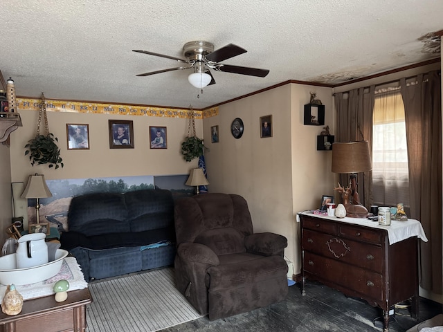 living area with ornamental molding, dark wood-type flooring, a textured ceiling, and a ceiling fan