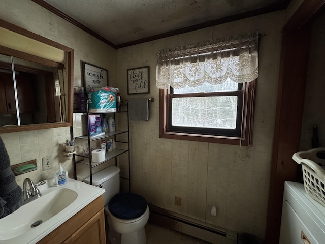 bathroom with toilet, a baseboard radiator, vanity, a textured ceiling, and crown molding