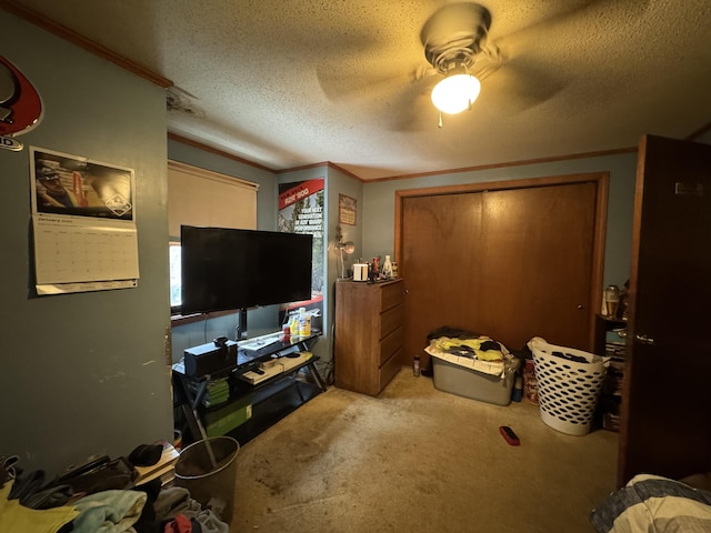 interior space featuring a textured ceiling, ceiling fan, and crown molding