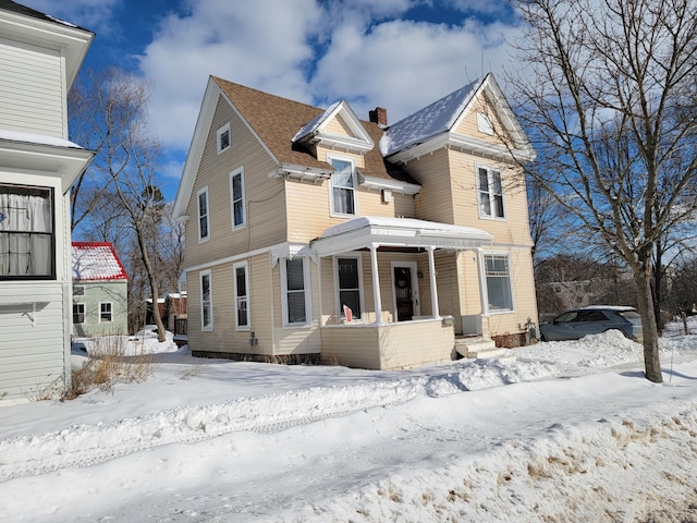 front of property featuring covered porch