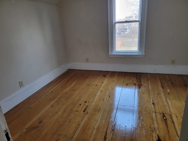 interior space with baseboards and hardwood / wood-style flooring