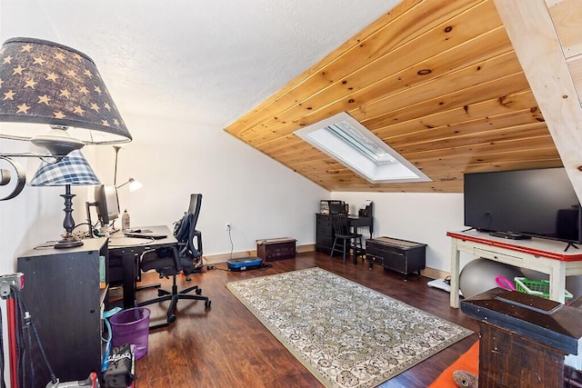 home office featuring lofted ceiling with skylight, wooden ceiling, and dark hardwood / wood-style floors