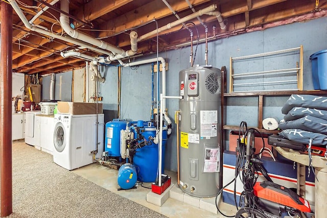 basement with washing machine and clothes dryer and electric water heater