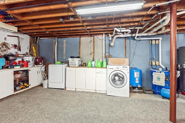 basement featuring washing machine and clothes dryer