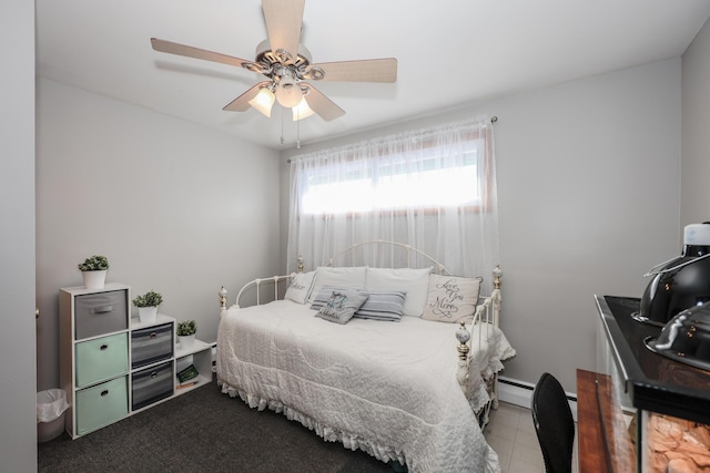 bedroom featuring a baseboard radiator and ceiling fan