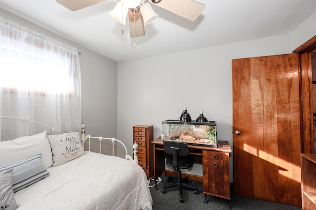 bedroom with dark carpet and ceiling fan