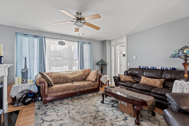 living room with hardwood / wood-style floors and ceiling fan